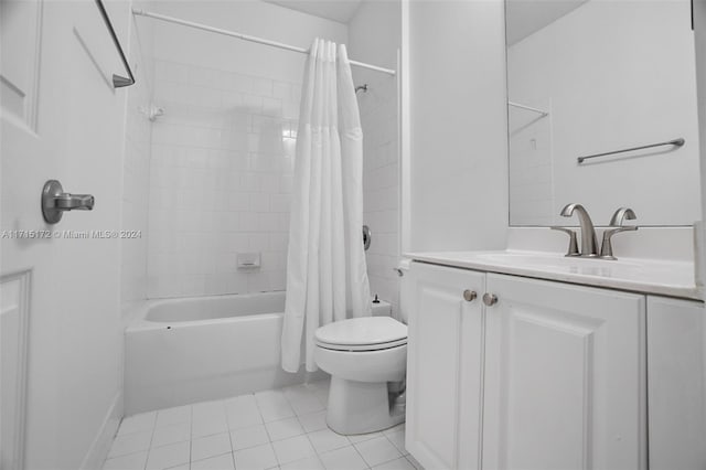 full bathroom with toilet, vanity, tile patterned floors, and shower / tub combo with curtain