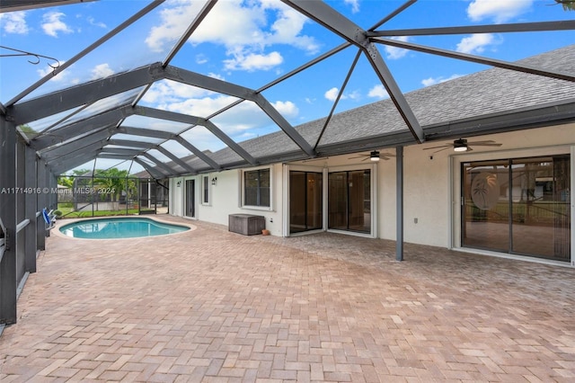 view of swimming pool featuring a lanai, a patio area, and ceiling fan