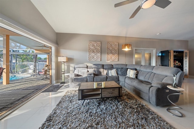 living room with ceiling fan and lofted ceiling