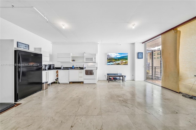 unfurnished living room featuring sink and a wall of windows