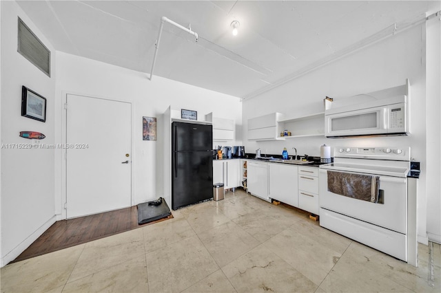 kitchen with white cabinets and white appliances