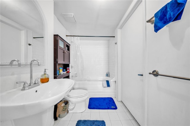 full bathroom with tile patterned flooring, shower / bath combo, toilet, and sink