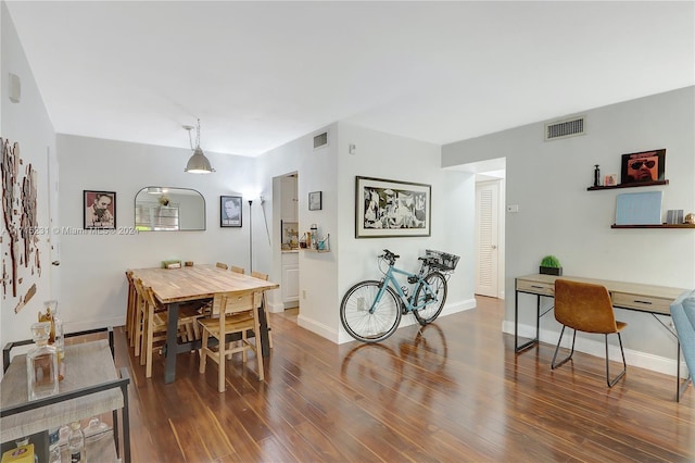 dining room with dark wood-type flooring