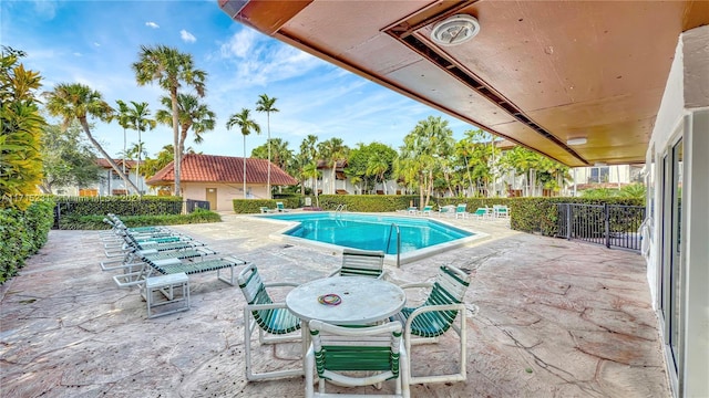 view of swimming pool with a patio area