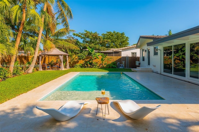 view of swimming pool with a gazebo and a patio area