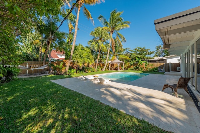 view of swimming pool featuring a gazebo, a yard, and a patio