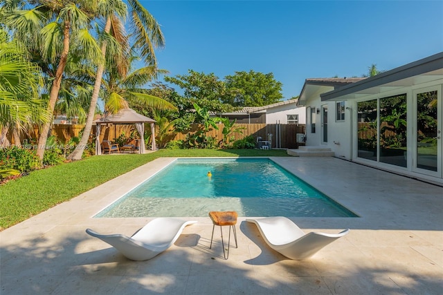 view of swimming pool with a gazebo and a patio area