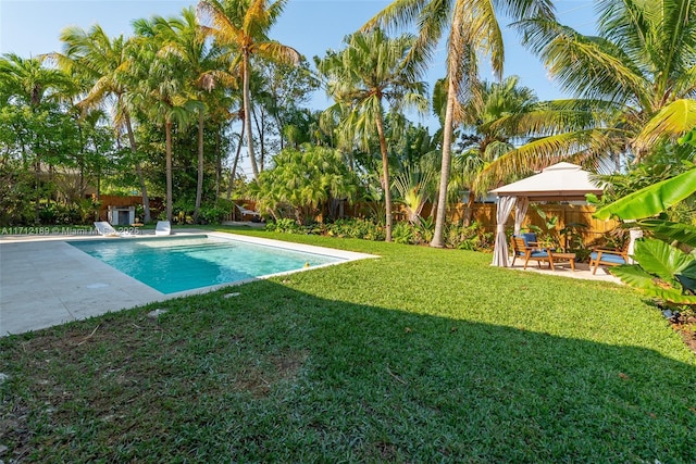 view of pool with a gazebo, a patio area, and a lawn