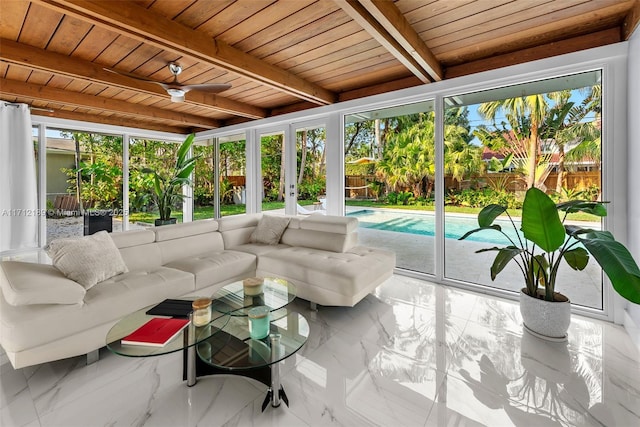 sunroom / solarium featuring beam ceiling, a wealth of natural light, ceiling fan, and wood ceiling