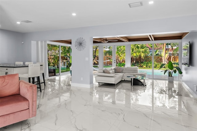 living room with a wealth of natural light and french doors