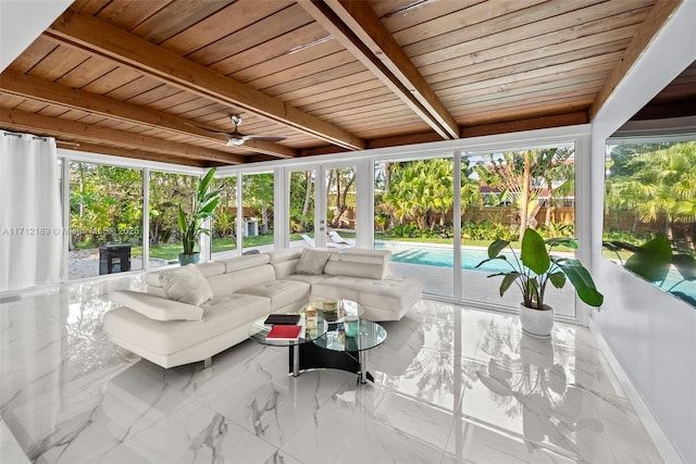 sunroom / solarium with beamed ceiling, a healthy amount of sunlight, and wood ceiling