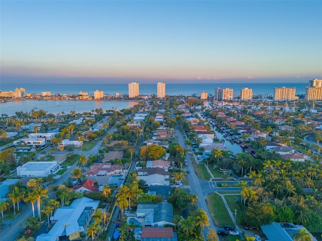 aerial view at dusk with a water view