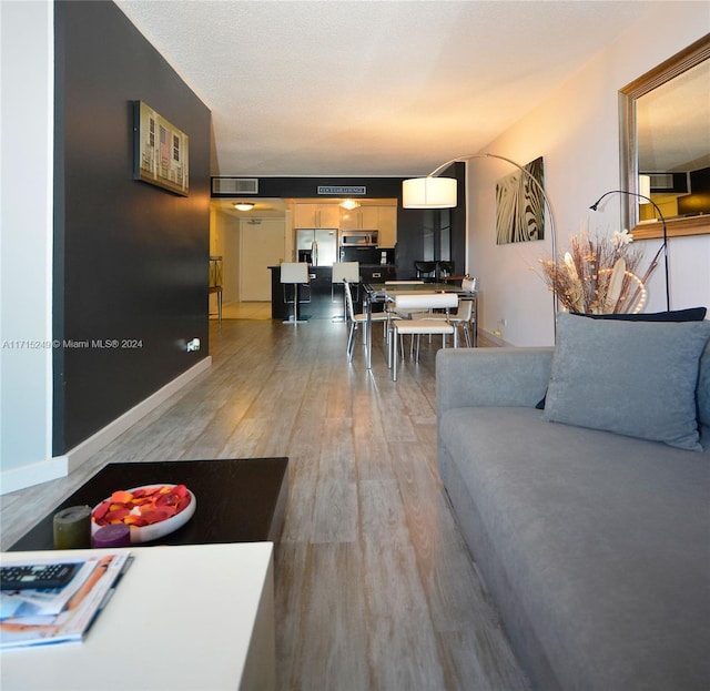 living room with hardwood / wood-style floors