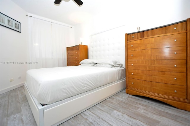 bedroom featuring ceiling fan and light hardwood / wood-style floors