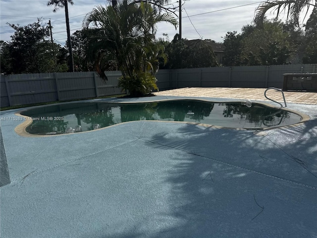 view of pool featuring a patio and central AC unit