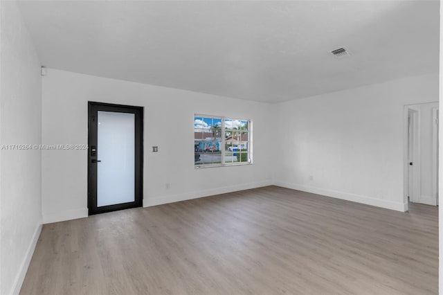 unfurnished room featuring light hardwood / wood-style flooring