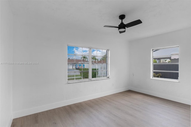 spare room with light hardwood / wood-style floors and ceiling fan