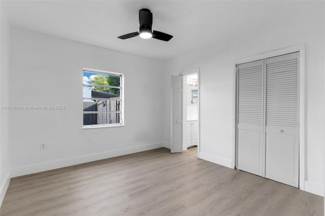 unfurnished bedroom featuring ceiling fan and light hardwood / wood-style floors