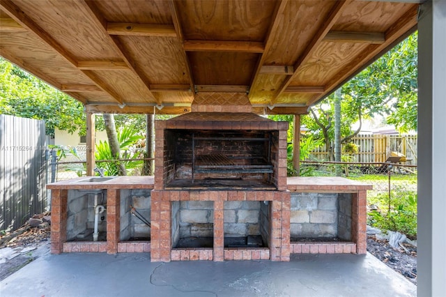 view of patio / terrace with an outdoor fireplace