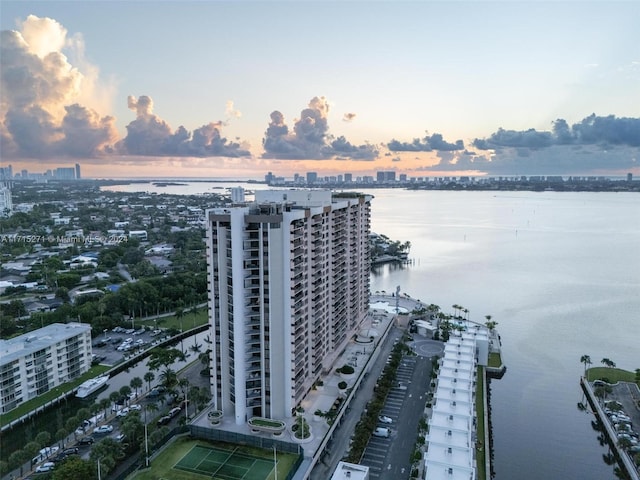 aerial view at dusk with a water view