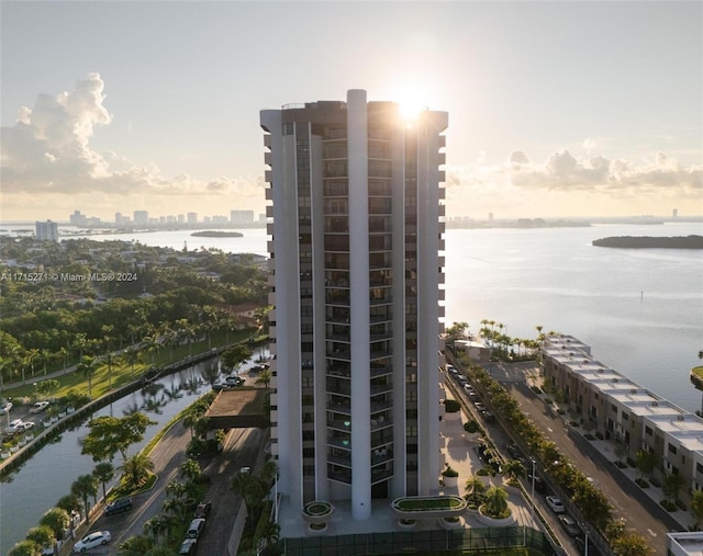 outdoor building at dusk featuring a water view