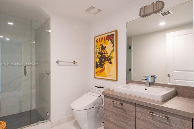 bathroom with an enclosed shower, vanity, and toilet