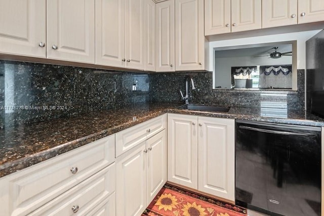 kitchen featuring white cabinets, sink, black dishwasher, and tasteful backsplash