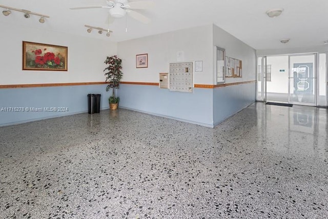 interior space featuring ceiling fan