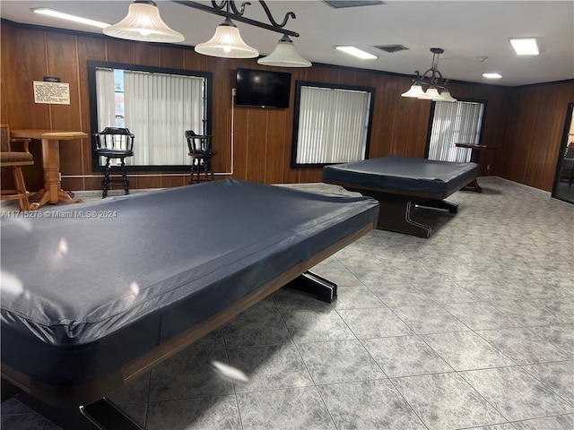 recreation room featuring wooden walls, light tile patterned flooring, and billiards