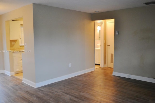 unfurnished room with hardwood / wood-style floors