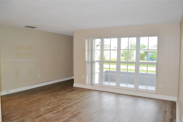 spare room featuring dark hardwood / wood-style floors