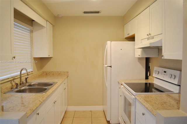 kitchen with sink, white electric stove, and white cabinets