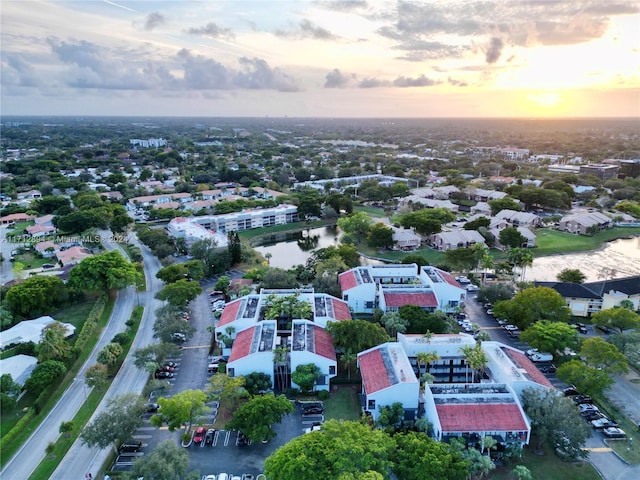 aerial view at dusk with a water view