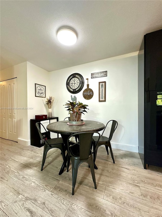 dining room featuring a textured ceiling