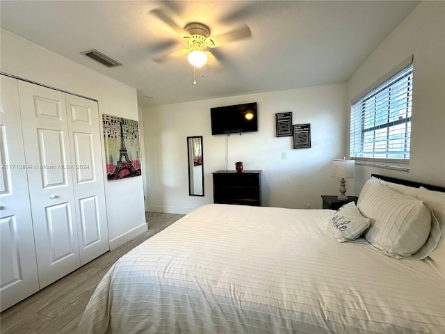 bedroom featuring a closet, hardwood / wood-style flooring, and ceiling fan