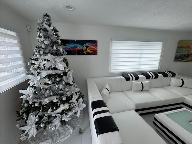 tiled living room with a textured ceiling