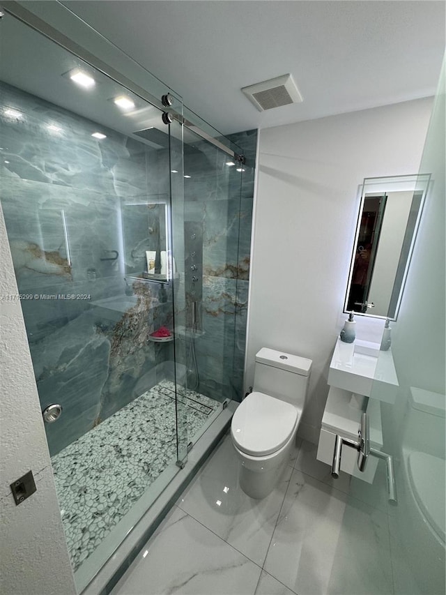 bathroom featuring toilet and walk in shower