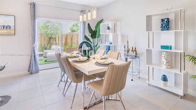 dining area with light tile patterned flooring