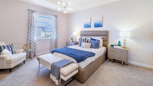 carpeted bedroom with an inviting chandelier