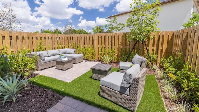 view of yard featuring an outdoor living space and a patio area