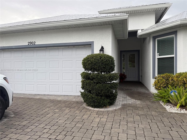 entrance to property featuring a garage