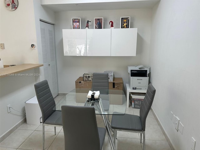 dining space featuring light tile patterned floors