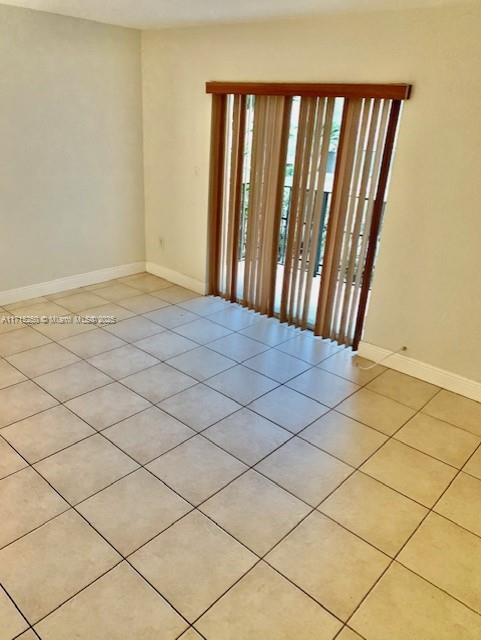 view of tiled spare room