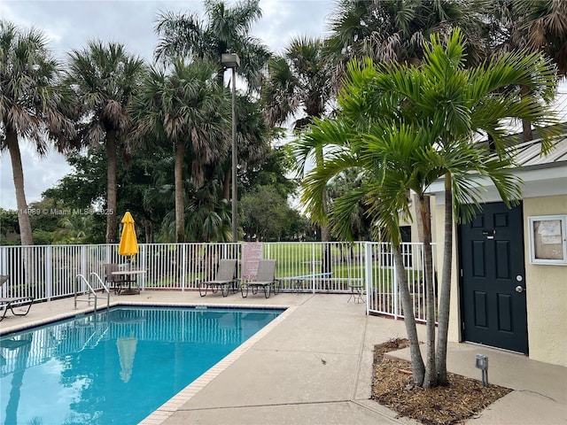 view of swimming pool with a patio area