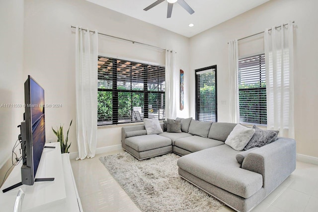 living room with ceiling fan and a healthy amount of sunlight