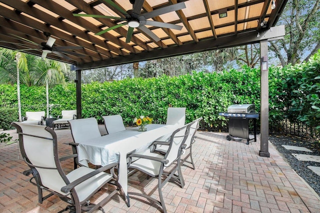 view of patio with ceiling fan and a grill