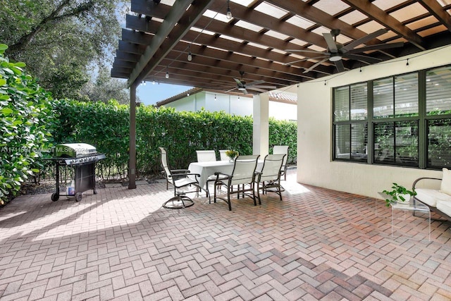 view of patio featuring ceiling fan, a grill, and a pergola