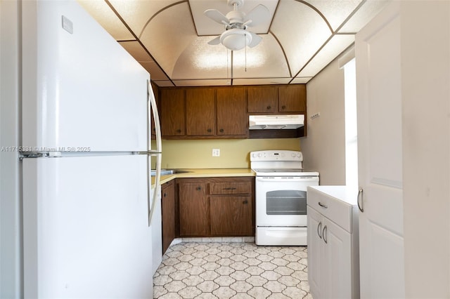 kitchen featuring ceiling fan and white appliances