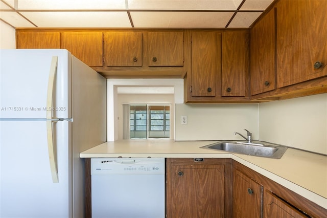 kitchen with white appliances and sink