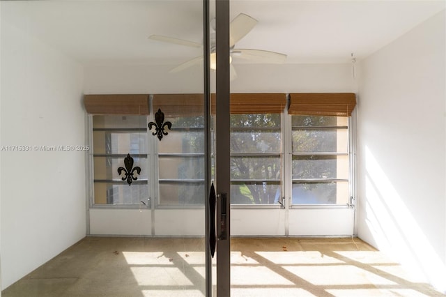 interior space featuring ceiling fan